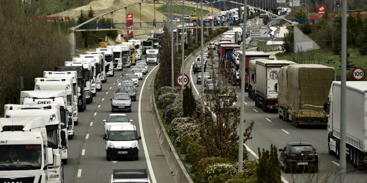 Hundreds of trucks line up to protest against the high price of fuel, in Pamplona, northern Spain, Monday, March 21, 2022. (AP Photo/Alvaro Barrientos)