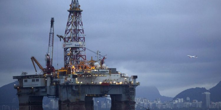 FILE - In this April 21, 2015 file photo an oil platform is seen in the waters of the Guanabara bay in Niteroi, Brazil. (AP Photo/Leo Correa, file)