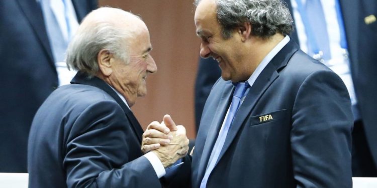 File picture of UEFA President Michel Platini (R) congratulating FIFA President Sepp Blatter after he was re-elected at the 65th FIFA Congress in Zurich, Switzerland, May 29, 2015.  Suspended FIFA President Blatter and European soccer boss Platini were both banned for eight years December 21, 2015 by FIFA's Ethics Committee. The pair, who have also been fined, had been suspended for 90 days in October while an investigation was carried out into a 2 million Swiss franc ($2.02 million) payment by FIFA to Platini in 2011. Both men have denied any wrongdoing.    REUTERS/Arnd Wiegmann TPX IMAGES OF THE DAY
